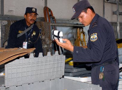 US Navy 100623-N-4971L-021 El Salvador civilian and military defense personnel conduct a practice warehouse search for drugs, weapons and contraband