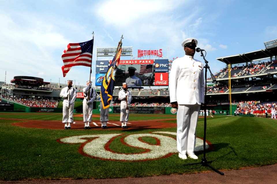 US Navy 100623-N-9818V-138 Chief Musician Daryl Duff, assigned to the U.S. Navy Band, sings the national anthem during Navy Day at Nationals park