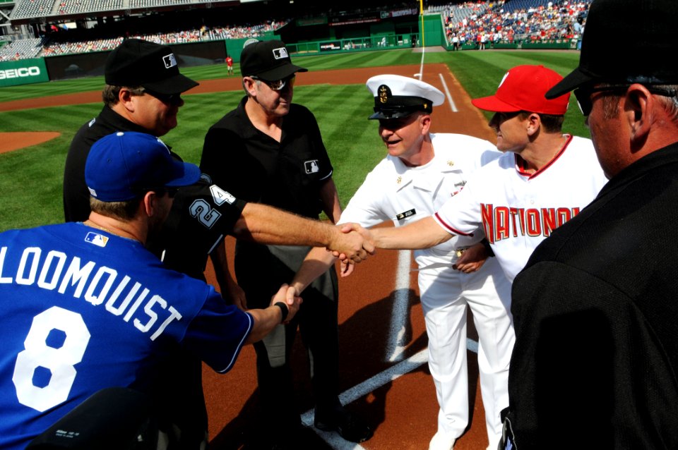 US Navy 100623-N-9818V-218 Master Chief Petty Officer of the Navy (MCPON) Rick West goes with Rick Eckstein, the hitting coach for the Washington Nationals, to take part in the pregame meeting at home plate for the symbolic lin