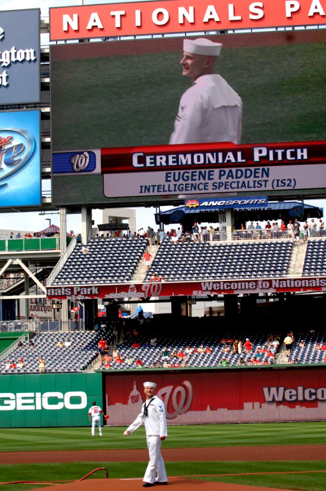 US Navy 100623-N-9818V-084 Intelligence Specialist 2nd Class Eugene Padden, the 2009 Chief of Naval Operations Junior Sailor of the Year, throws out the ceremonial first pitch during Navy Day at Nationals Park
