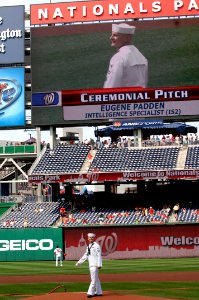 US Navy 100623-N-9818V-084 Intelligence Specialist 2nd Class Eugene Padden, the 2009 Chief of Naval Operations Junior Sailor of the Year, throws out the ceremonial first pitch during Navy Day at Nationals Park