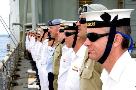 US Navy 100626-O-8247T-021 The Royal Australian Navy amphibious landing platform HMAS Kanimbla (L 51) sailors line the upper decks of the ship as she pulls into Pearl Harbor, Hawaii photo