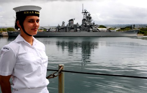 US Navy 100626-O-8247M-059 Royal Australian Navy Seaman Steward Ronelle Fitzgerald stands at procedure alpha as the Royal Australian Navy amphibious landing platform HMAS Kanimbla (L 51) passes the USS Missouri memorial