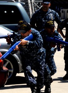 US Navy 100624-N-2918M-051 Sailors assigned to the force protection training team of the aircraft carrier USS Nimitz (CVN 68) demonstrate how to properly advance in dangerous situations