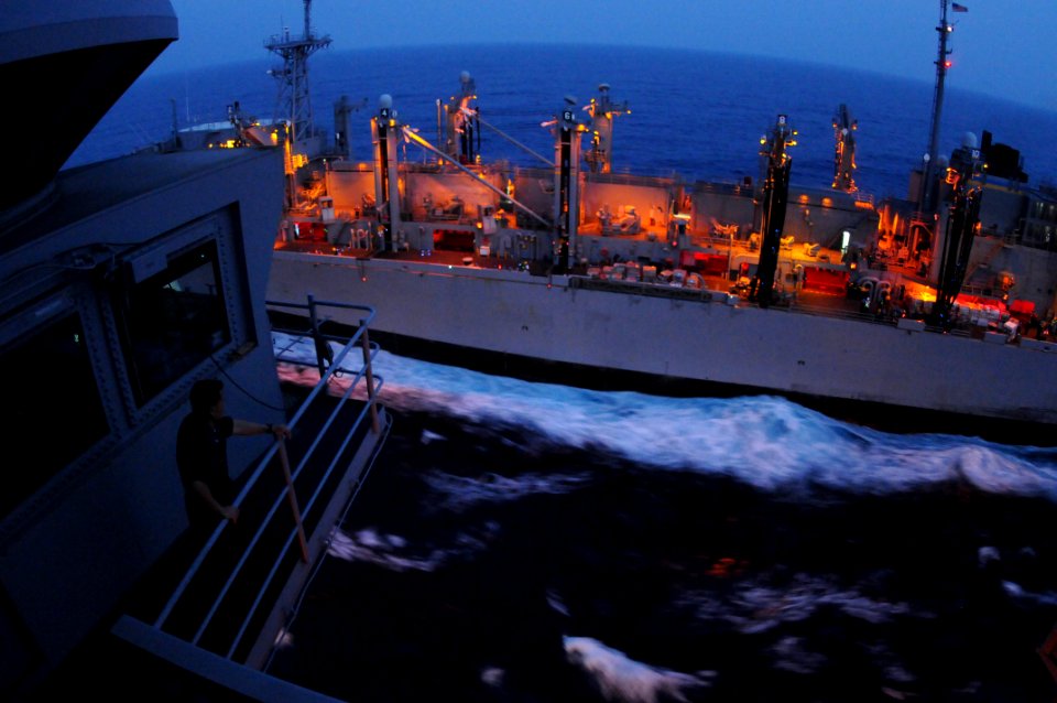 US Navy 100627-N-1004S-116 Capt. Ronald Ravelo, executive officer of the aircraft carrier USS Ronald Reagan (CVN 76), observes the Military Sealift Command fast combat support ship USNS Bridge (T-AOE 10)
