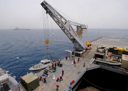 US Navy 100626-N-1082Z-039 Sailors aboard the amphibious dock landing ship USS Ashland (LSD 48) prepare a rigid hull inflatable boat for the transfer