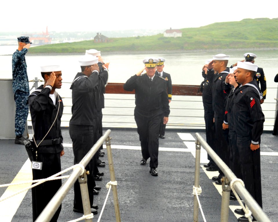 US Navy 100628-N-3548M-049 Chief of Naval Operations (CNO) Adm. Gary Roughead salutes Sailors from the guided-missile cruiser USS Gettysburg as he goes aboard to speak with Sailors and tour the ship photo