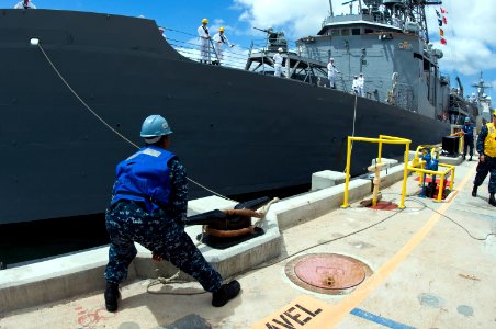 US Navy 100624-N-6674H-022 Sailors moor the Oliver Hazard Perry-class guided-missile frigate USS Ford (FFG 54) to the pier at Joint Base Pearl Harbor-Hickam for Rim of the Pacific (RIMPAC) 2010