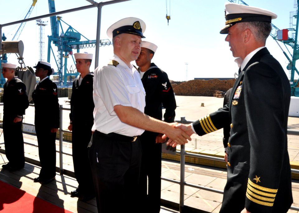 US Navy 100628-N-5483N-004 Capt. Karl Thomas, commanding officer of the amphibious command ship USS Mount Whitney (LCC-JCC 20), greets Capt. Rimants Strimaitis, commander of the Latvian navy, aboard Mount Whitney