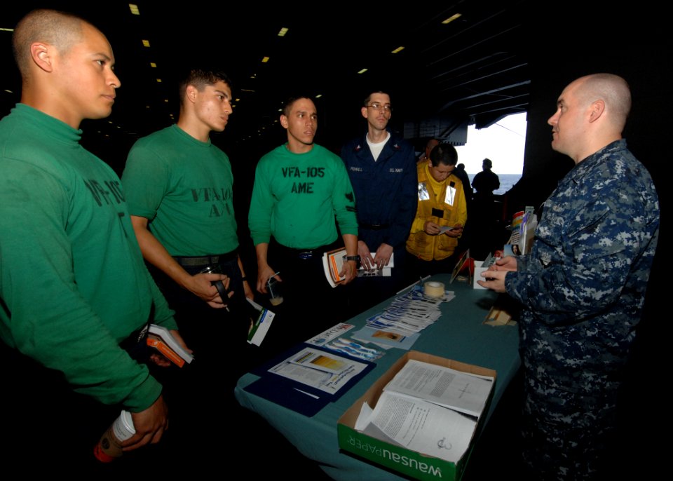 US Navy 100625-N-3705H-029 Hospital Corpsman 1st Class Justin Pearce speaks to a group of Sailors about stress, hydration, and overall health during a mind, body and spirit campaign aboard the aircraft carrier USS Harry S. Trum