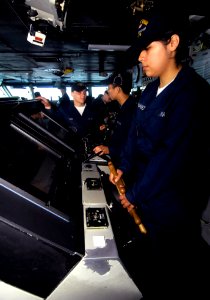 US Navy 100628-N-4135M-067 Boatswain's Mate Seaman Recruit Donica Hernandez steers the aircraft carrier USS Harry S. Truman (CVN 75) while standing watch as helmsman