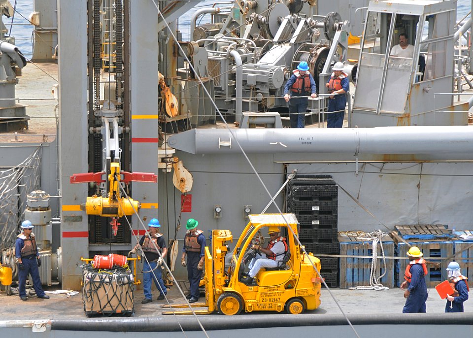 US Navy 100626-N-1082Z-019 Crew members aboard the Military Sealift Command fleet replenishment oiler USNS John Lenthall (T-AO 189) prepare a pallet of supplies