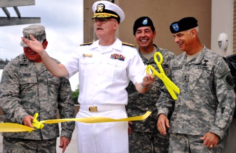 US Navy 100630-D-5422E-003 Rear Adm. William R. Kiser, commandant of the Joint Medical Education and Training Center, middle, celebrates cutting the ribbon to open the training center at Fort Sam Houston