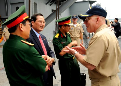 US Navy 100630-N-7908T-047 Capt. Chip Miller, right, commanding officer of the aircraft carrier USS George H.W. Bush (CVN 77) speaks with Deputy Chief of Mission Minh Tien Nguyen of Vietnam