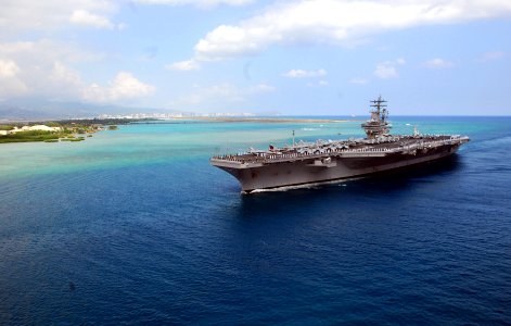 US Navy 100628-N-5684M-461 Sailors and Marines man the rails aboard the aircraft carrier USS Ronald Reagan (CVN 76) as the ship transits Pearl Harbor