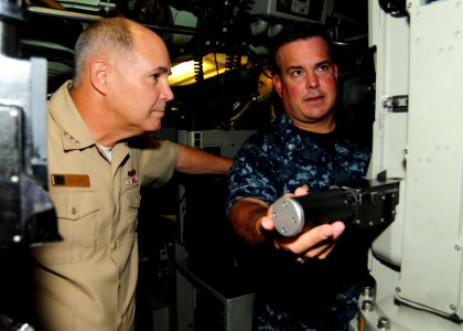 US Navy 100701-N-3570S-083 Cmdr. Howard Warner III shows Vice Adm. Richard W. Hunt the periscope and uses of its new design while on a tour of the ship during Rim of the Pacific (RIMPAC) 2010 exercises