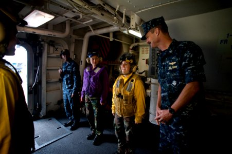 US Navy 100701-N-5319A-036 Capt. Peter Brennan jokes with Aviation Boatswain's Mate 3rd Class Kelley Soucy