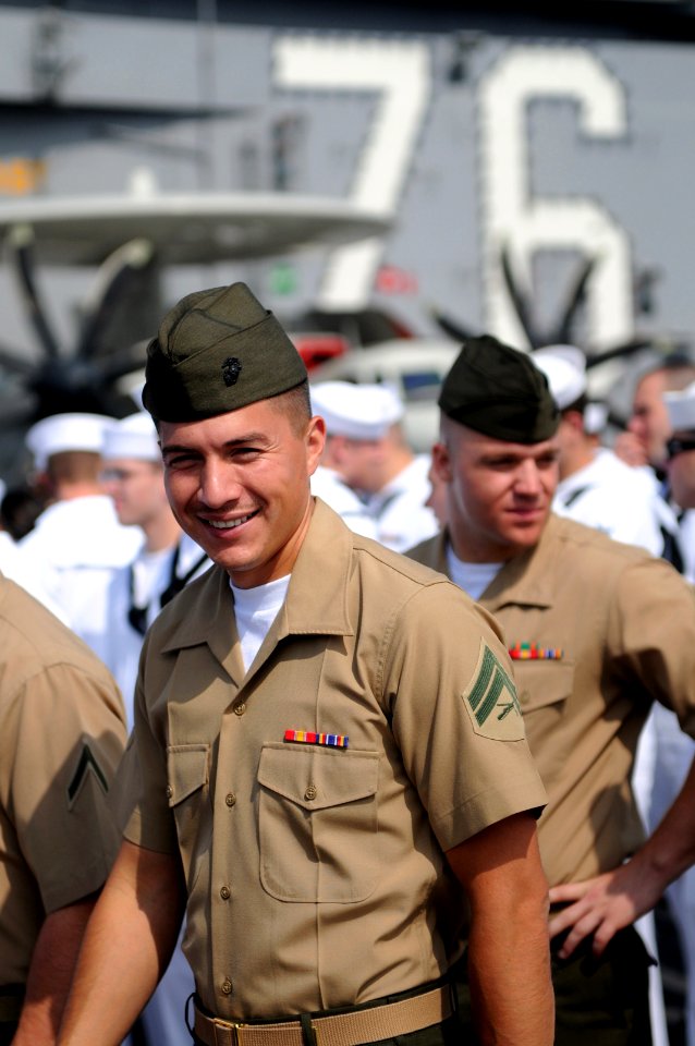 US Navy 100628-N-9132C-154 Cpl. Patrick Ramirez, assigned to the Death Rattlers of Marine Fighter Attack Squadron (VMFA) 323, musters on the flight deck of the aircraft carrier USS Ronald Reagan (CVN 76)