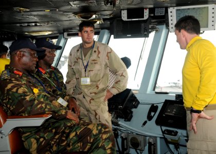 US Navy 100629-N-4236E-590 A Sailor explains bridge operations to distinguished visitors from the Kenyan Armed Forces, who were guests of U.S. Africa Command and Combined Joint Task Force, Horn of Africa