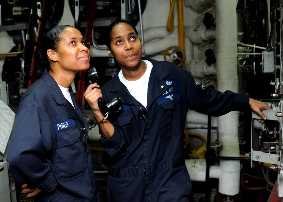 US Navy 100629-N-5215E-029 Machinist's Mate Firemen Sonia Philip, left, and Sophia Philip report the status of the ship's ^2 boiler during the Board of Inspection and Survey