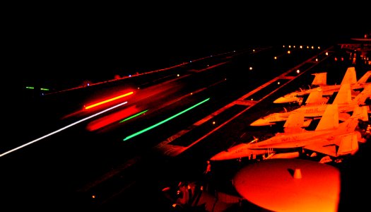 US Navy 100629-N-6003P-195 An F-A-18 Hornet lands aboard the aircraft carrier USS Harry S. Truman (CVN 75) during night flight operations