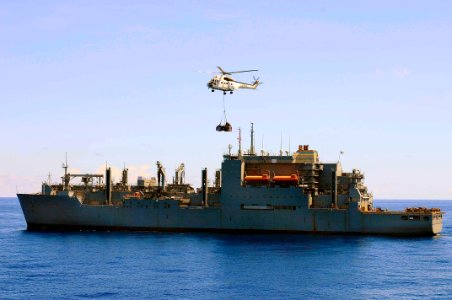 US Navy 100629-N-6410J-032 A Military Sealift Command-contracted SA-330J Puma helicopter transports cargo from the Military Sealift Command dry cargo and ammunition ship USNS Richard E. Byrd (T-AKE 4)