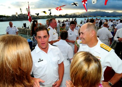 US Navy 100701-N-3570S-207 Subordinate Officer Nicholson explains to Vice Adm. Richard W. Hunt the significance of Canada Day during Rim of the Pacific (RIMPAC) 2010 Canadian Reception