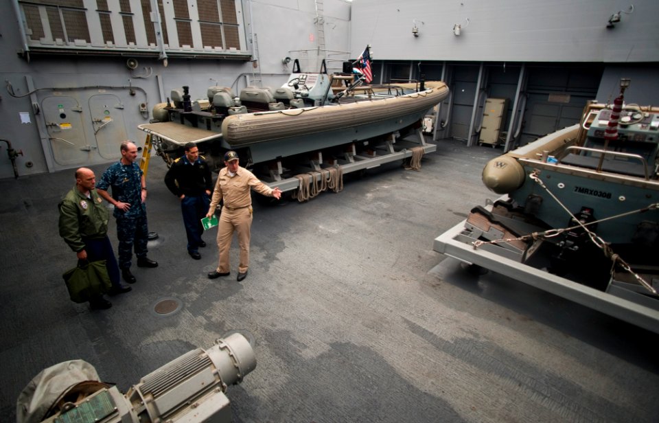 US Navy 100701-N-5319A-046 Capt. Peter Brennan and Cmdr. Jeffrey Oakey give Cmdr. Scott Smith and Capt. Brian Nickerson a tour of USS New Orleans (LPD 18)