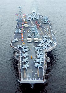 US Navy 100703-N-6720T-047 Sailors aboard aircraft carrier USS George Washington (CVN 73) spell out George Washington on the flight deck while arriving in port to commemorate the ships 18 years of Naval service