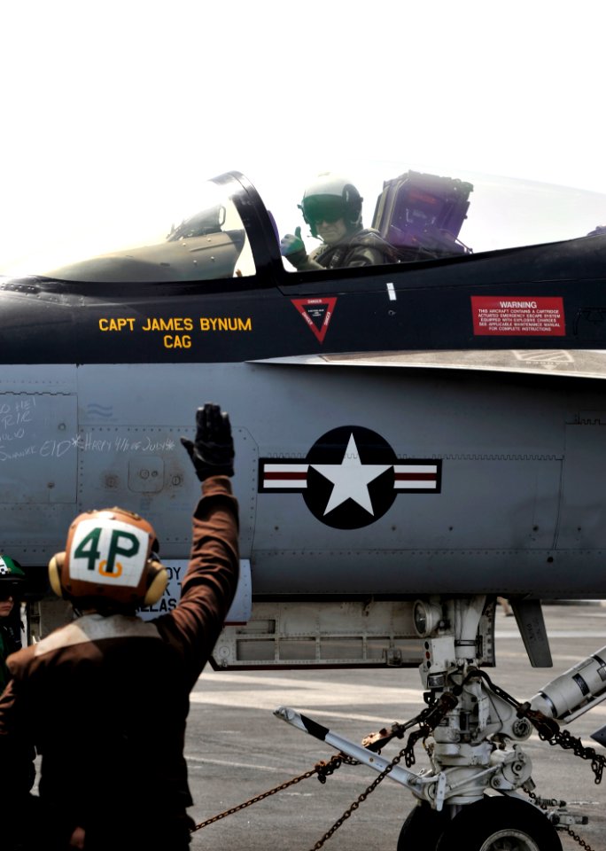 US Navy 100704-N-6003P-228 Rear Adm. Patrick Driscoll commander of Strike Group 10, gives a thumbs-up after a pre-flight check