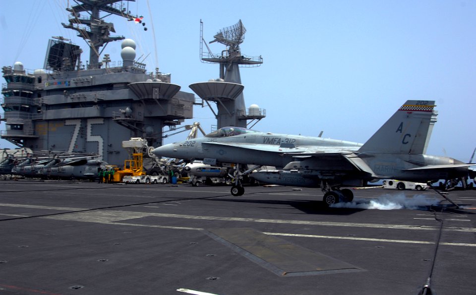 US Navy 100630-N-4135M-107 An F-A-18C Hornet assigned to the Checkerboards of Marine Fighter Attack Squadron (VMFA) 312 lands aboard the aircraft carrier USS Harry S. Truman (CVN 75)