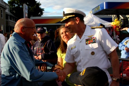 US Navy 100701-N-3038C-154 Rear Adm. Mark Boensel, commander of Navy Region Mid-Atlantic, greets World War II U.S. Army veteran Joe Piro photo