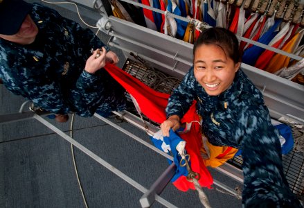US Navy 100701-N-5319A-028 Ensigns Jessica Alabata and Andrew Norris take turns raising signal flags during flag signaling drills
