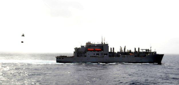 US Navy 100701-N-6003P-068 An MH-60S Sea Hawk helicopter transports supplies from the Military Sealift Command dry cargo and ammunition ship USNS Sacagawea (T-AKE 2)