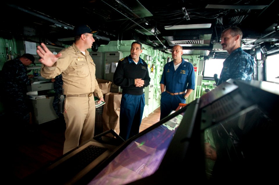 US Navy 100701-N-5319A-053 Cmdr. Jeffrey Oakey gives a tour of the ship's bridge to Cmdr. Scott Smith and Capt. Brian Nickerson
