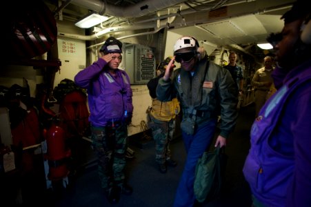 US Navy 100701-N-5319A-064 Aviation Boatswain's Mate (Fuel) Airman Karina Allain salutes Capt. Brian Nickerson