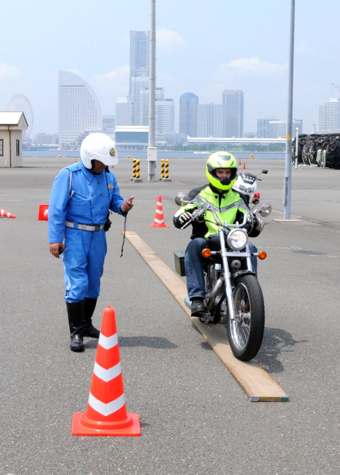 US Navy 100702-N-2218S-002 Sailors practice their motorcycle skills and safety techniques with Shirobai, elite Japanese motorcycle police officers