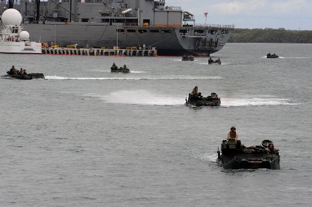 US Navy 100702-N-9500T-227 Vehicles from Armored Assault Vehicle Platoon, Combat Assault Company, 3rd Marine Regiment, make their way to the Royal Australian Navy amphibious ship HMAS Kanimbla (L 51)