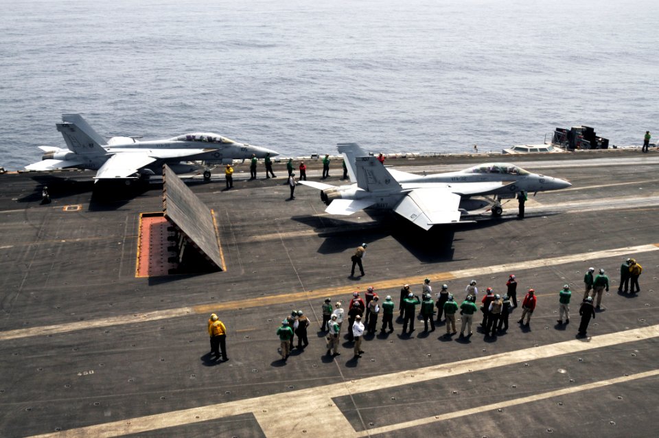 US Navy 100703-N-6362C-121 F-A-18F Super Hornets assigned to the Swordsmen of Strike Fighter Squadron (VFA) 32 prepare to launch from the aircraft carrier USS Harry S. Truman (CVN 75) for a change of command ceremony