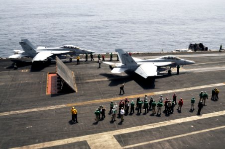 US Navy 100703-N-6362C-121 F-A-18F Super Hornets assigned to the Swordsmen of Strike Fighter Squadron (VFA) 32 prepare to launch from the aircraft carrier USS Harry S. Truman (CVN 75) for a change of command ceremony