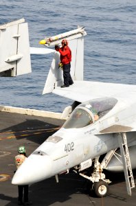 US Navy 100703-N-6362C-005 An Aviation Ordnanceman assigned to the Gunslingers of Strike Fighter Squadron (VFA) 105 performs ordnance preflight checks aboard the aircraft carrier USS Harry S. Truman (CVN 75)
