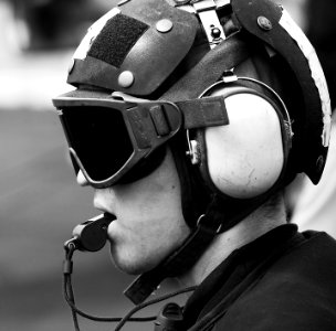 US Navy 100707-N-7317W-021 A Sailor supervises flight operations aboard the aircraft carrier USS Harry S. Truman (CVN 75)