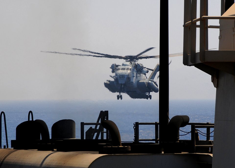 US Navy 100704-N-1082Z-007 A CH-53E Super Stallion helicopter from the Golden Eagles of Marine Medium Tiltrotor Squadron (VMM) 162 (Reinforced), prepares to land aboard the amphibious dock landing ship USS Ashland (LSD 48)