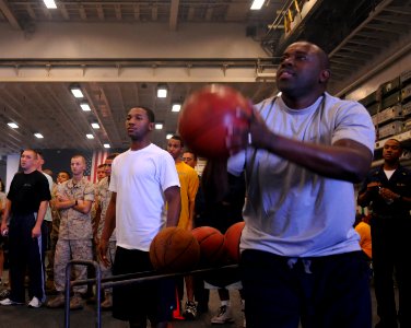 US Navy 100704-N-3852A-799 Master-at-Arms 1st Class Cleveland Lee participates in a three-point basketball shoot-out