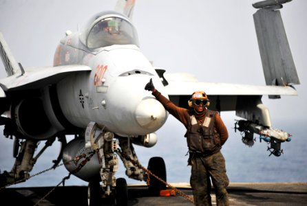US Navy 100704-N-6003P-077 A plane captain assigned to the Checkerboards of Marine Fighter Attack Squadron (VMFA) 312 gives a thumbs-up to signal that the F-A-18C Hornet is ready to be moved
