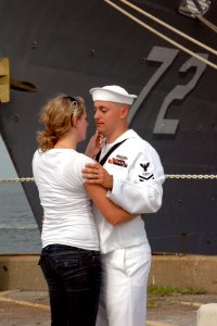US Navy 100708-N-5292M-647 Fire Controlman 2nd Class Kevin Cunningham, assigned to the guided-missile cruiser USS Vella Gulf (CG 72), says good-bye to his wife at Naval Station Norfolk photo