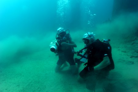 US Navy 100708-N-4776G-158 Explosive Ordnance Disposal Technician 3rd Class Jonathan Sokol conducts training on a AN-PQS 2A hand held sonar photo