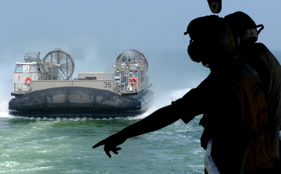 US Navy 100707-N-8069G-070 Sailors wait to direct a landing craft air cushion as it approaches USS Carter Hall (LSD 50)