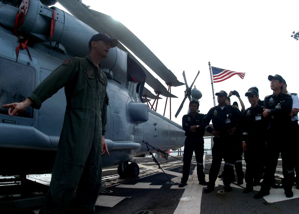US Navy 100709-N-0995C-024 Lt. Cmdr. Chris Gavin answers questions about the SH-60B Sea Hawk helicopter for Republic of Singapore Air Force pilots