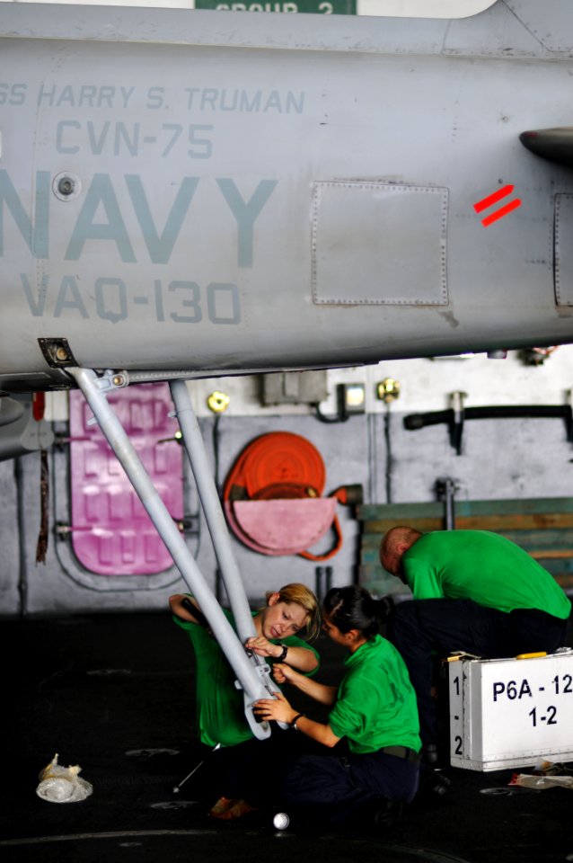 US Navy 100706-N-6362C-055 Aviation Structural Mechanic Airmen Norma Domingo and Sheila Corban, assigned to the Zappers of Electronic Attack Squadron (VAQ) 130, perform maintenance